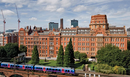 A train passing in front of the Sackville Street Building