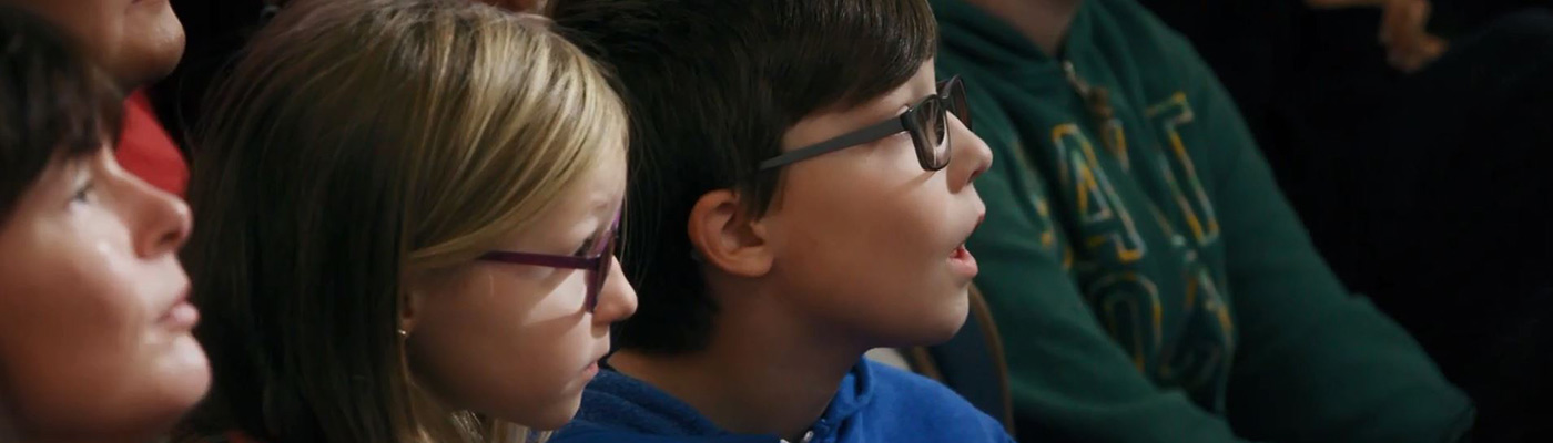 Two primary school students staring in amazement at Robot Orchestra