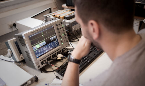 Man studying display on electrical equipment