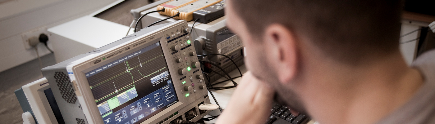 Man studying display on electrical equipment