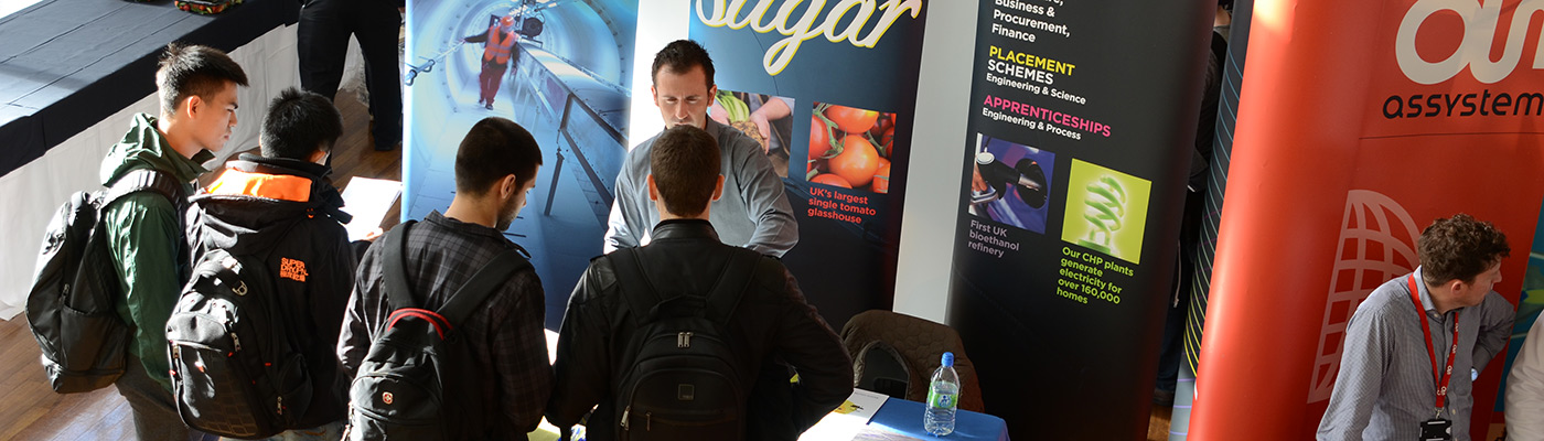 Students asking questions at a careers fair