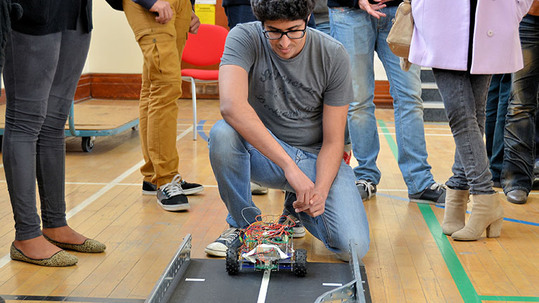 A student with his robot car
