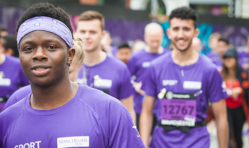 A male student running the Manchester 10k